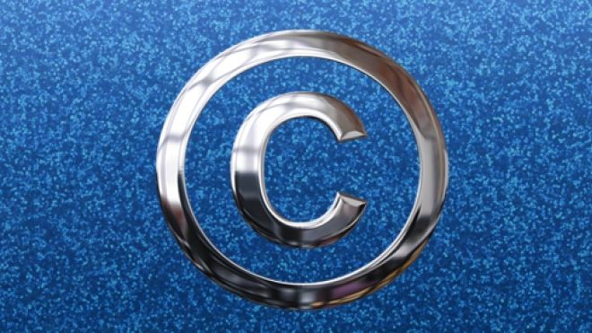 silver copyright symbol on a sparkley blue background