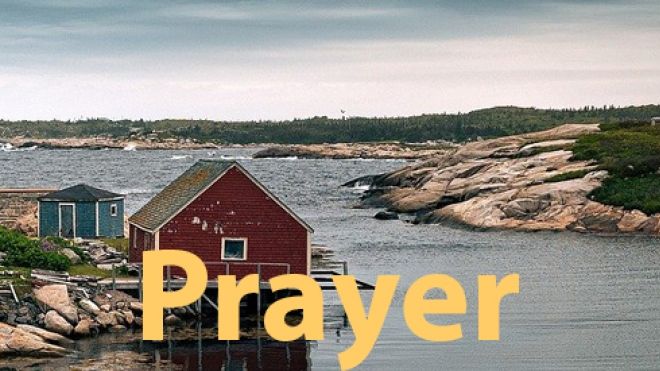 Photo of a rocky east coast inlet with cabins