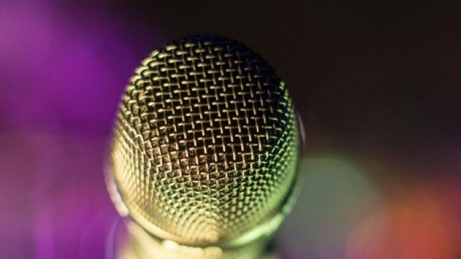 close-up of a microphone in a multicolored background