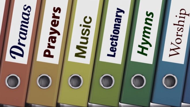 Binders with Music, Prayers, Lectionary, Hymns on the spine