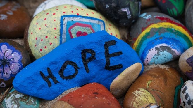 painted rocks with Hope written on a blue one