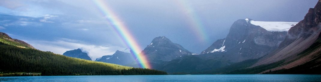 In peace we can let your light photo of rainbow from above in a mountain and sea background
