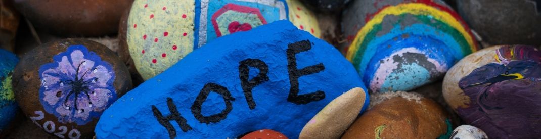 painted rocks with Hope written on a blue one