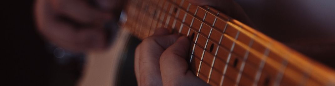 hands on a guitar